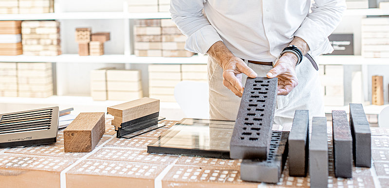Close Up on Hands and Clincer brick in long formats 